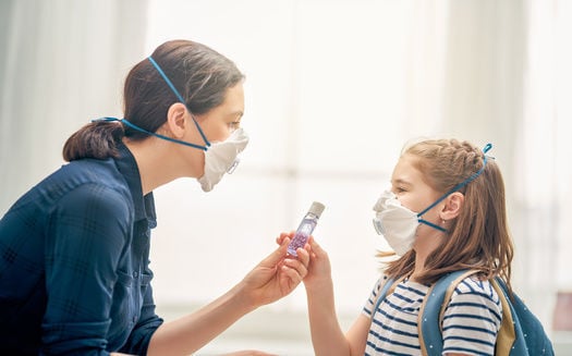 Mother and child wearing facemasks